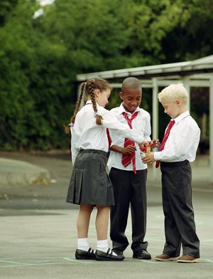 Small kids in the old school uniform